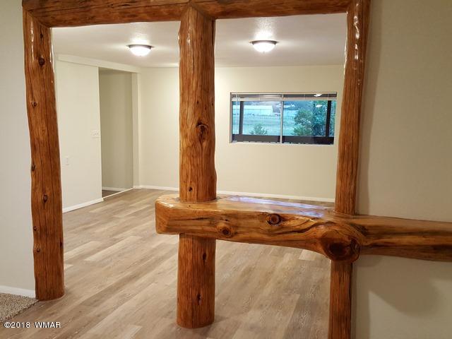 1128 East Maricopa Drive Springerville, AZ 85938 - Photo 13 of 28 a view of a door and wooden floor