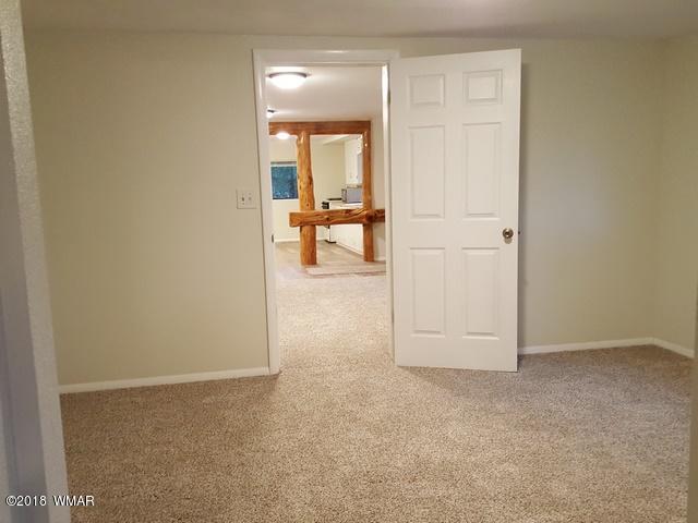 1128 East Maricopa Drive Springerville, AZ 85938 - Photo 21 of 28 wooden floor in a room