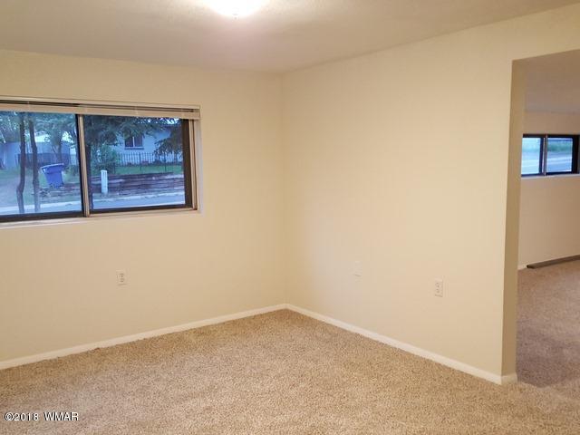 1128 East Maricopa Drive Springerville, AZ 85938 - Photo 22 of 28 a view of an empty room with a window