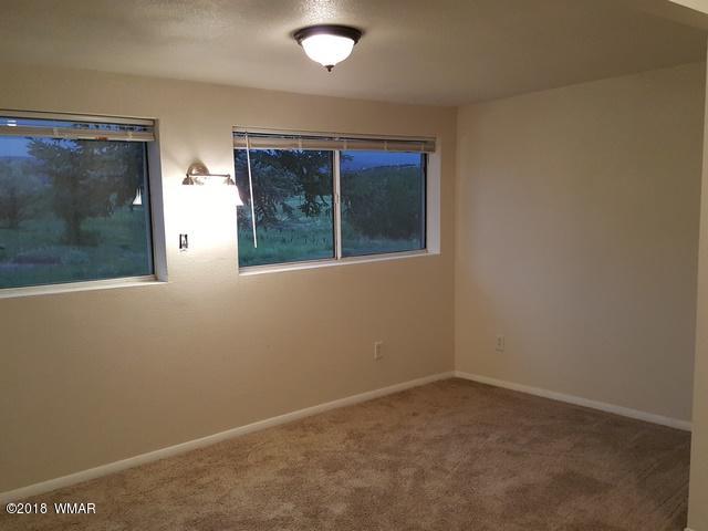 1128 East Maricopa Drive Springerville, AZ 85938 - Photo 24 of 28 an empty room with a window