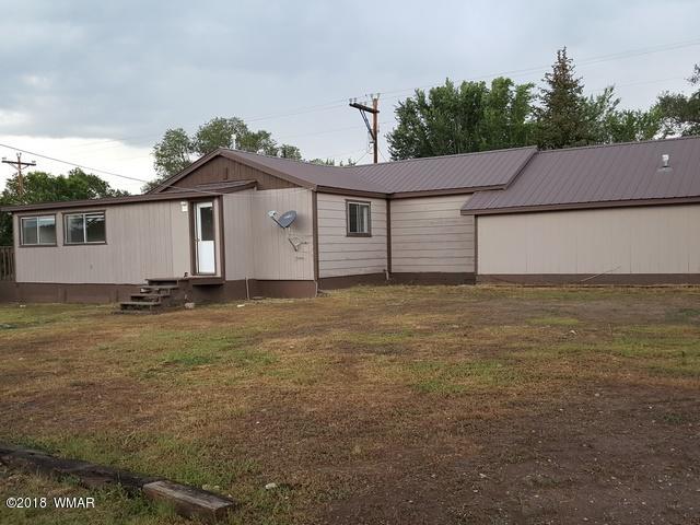 1128 East Maricopa Drive Springerville, AZ 85938 - Photo 4 of 28 a view of a house with a yard