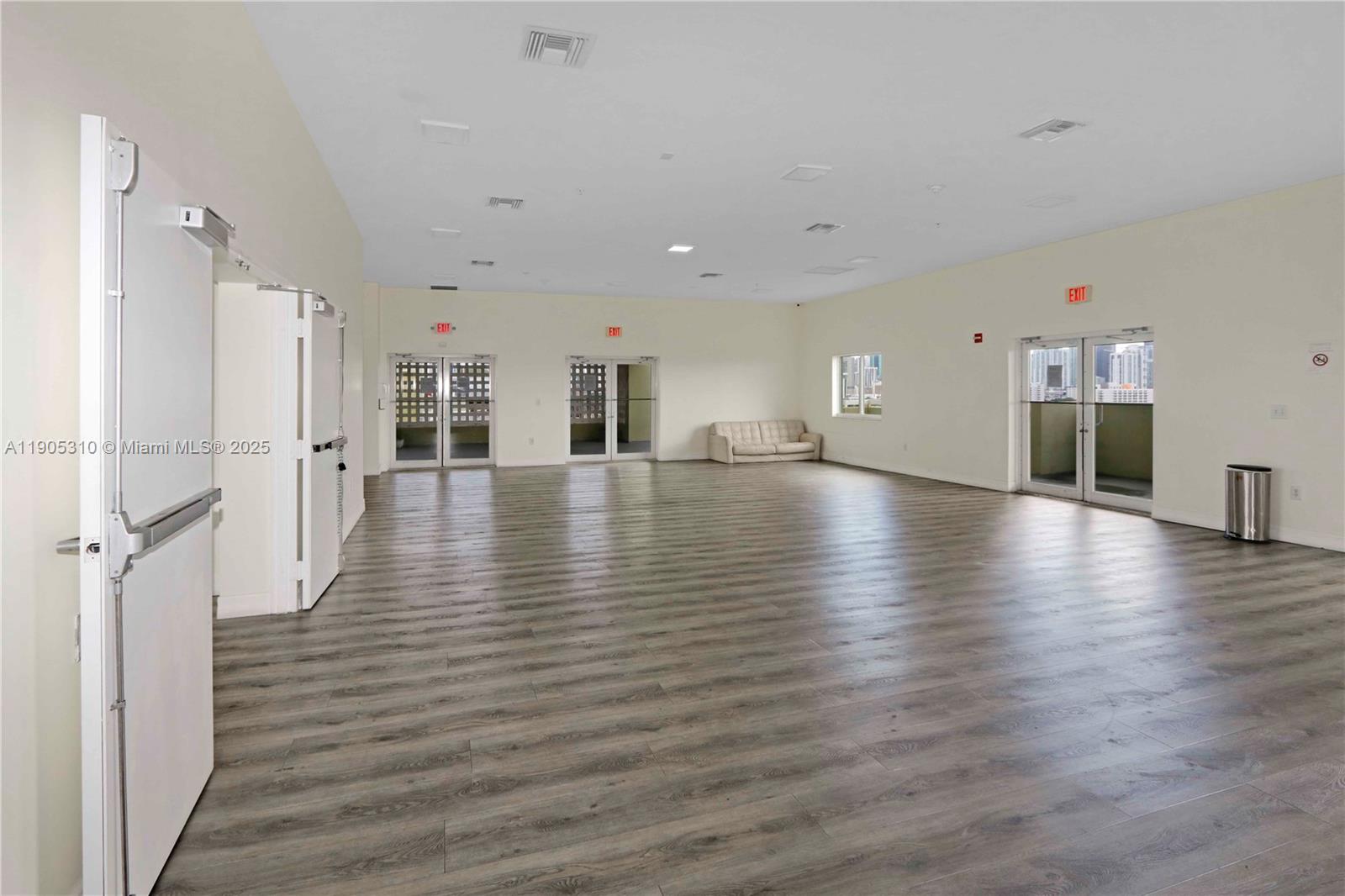 816 Northwest 11th Street, Unit 610 Miami, FL 33136 - Photo 24 of 28 a view of a room with wooden floor