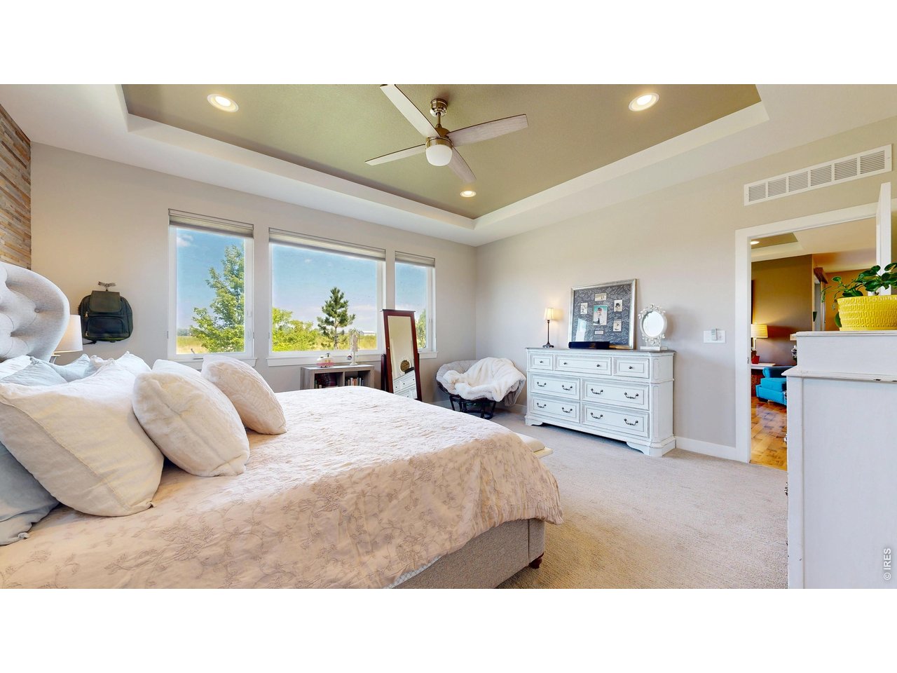 6990 Toponas Court Timnath, CO 80547 - Photo 14 of 44 a bedroom with a bed and dresser