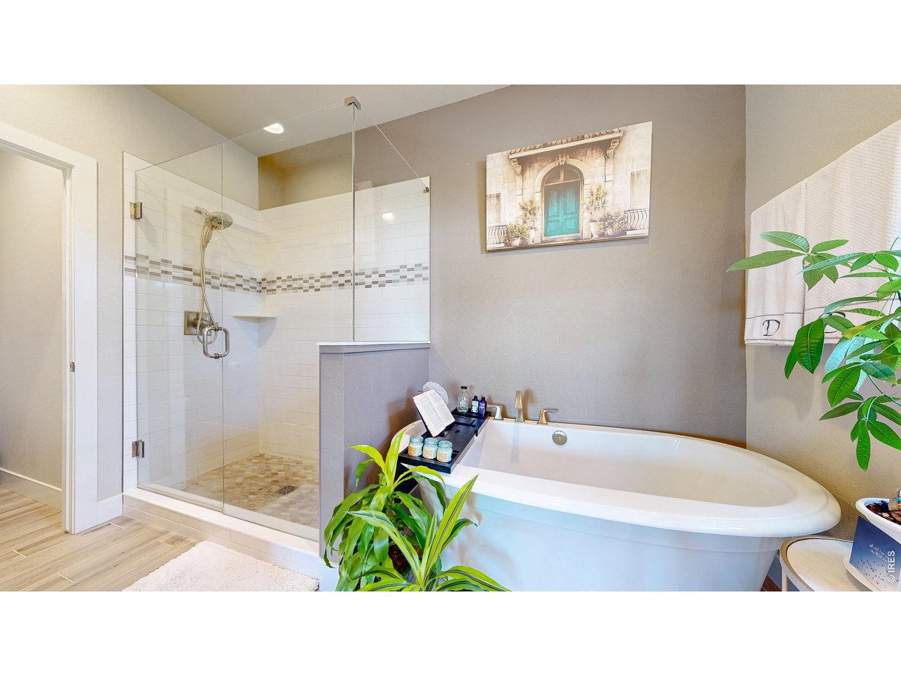 6990 Toponas Court Timnath, CO 80547 - Photo 16 of 44 a bathroom with a tub and a shower