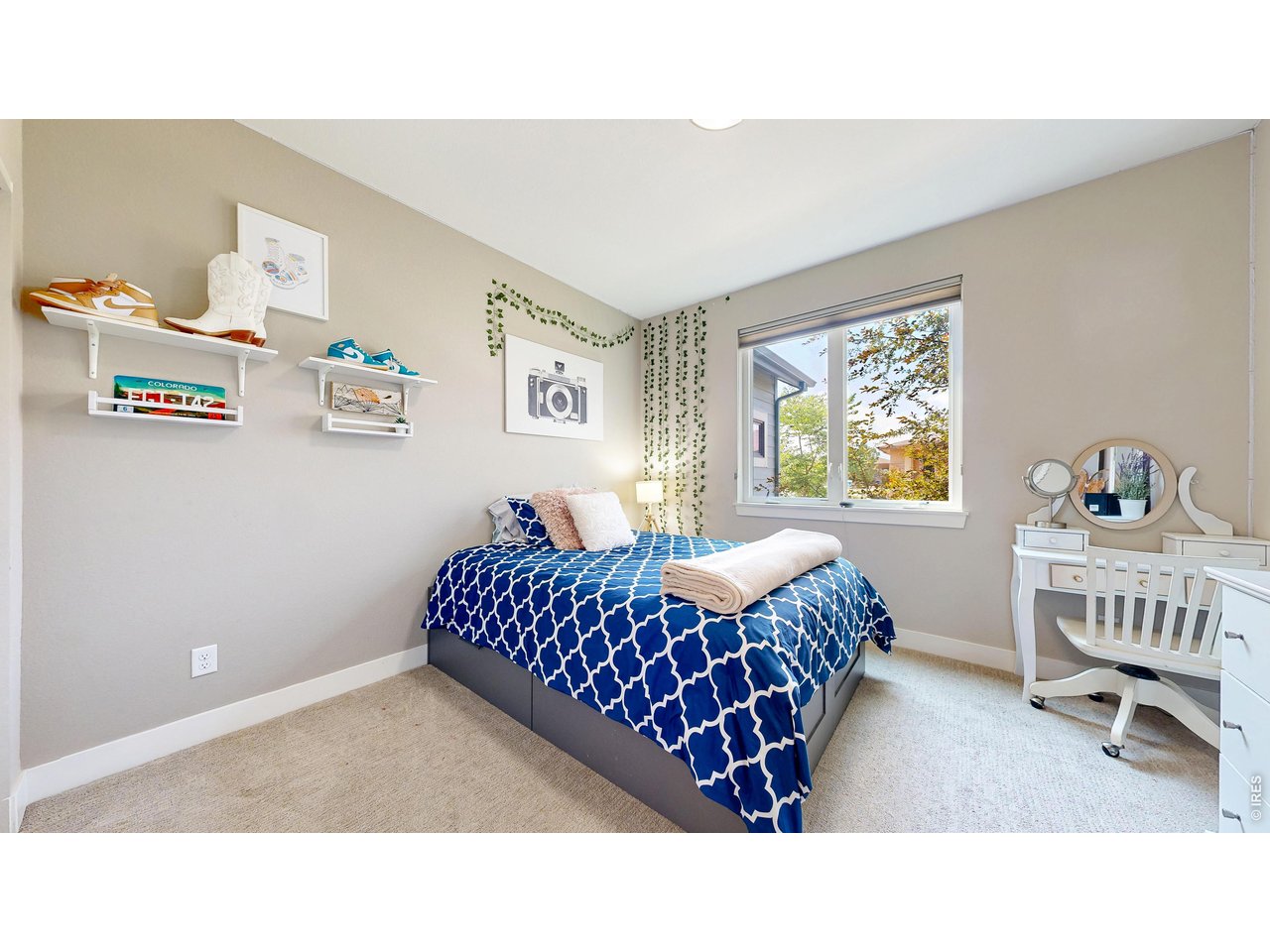 6990 Toponas Court Timnath, CO 80547 - Photo 17 of 44 a bedroom with a bed and a window
