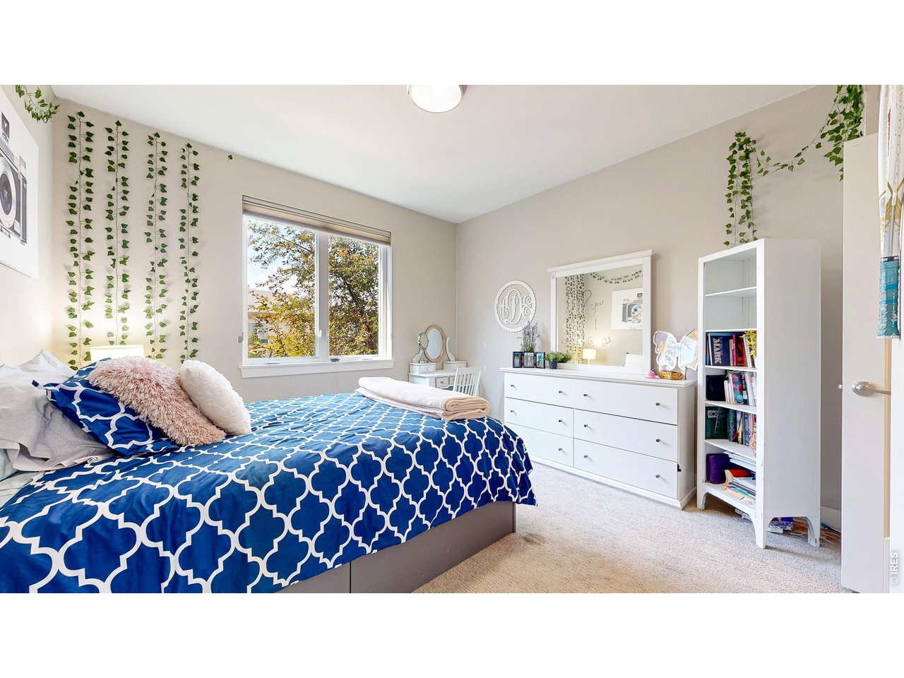 6990 Toponas Court Timnath, CO 80547 - Photo 18 of 44 a bedroom with a bed and window