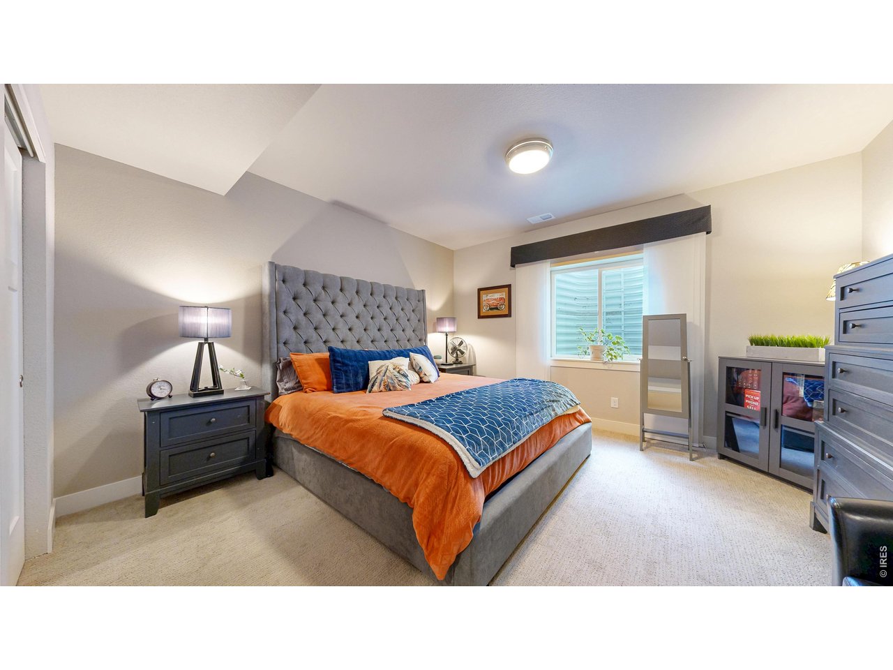 6990 Toponas Court Timnath, CO 80547 - Photo 24 of 44 a bedroom with bed and window