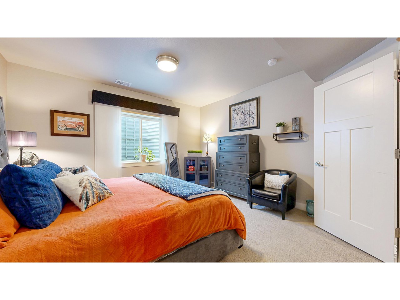 6990 Toponas Court Timnath, CO 80547 - Photo 25 of 44 a bedroom with a bed and dresser