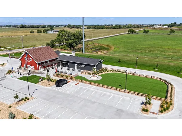 a view of a lake with a table and chairs