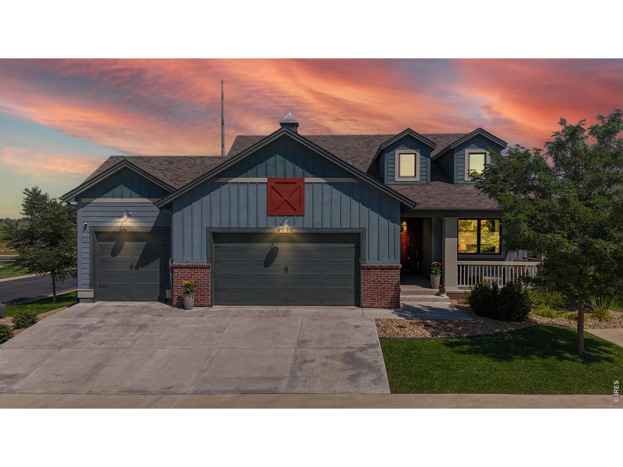 6990 Toponas Court Timnath, CO 80547 - Photo 42 of 44 a front view of a house with a yard and garage