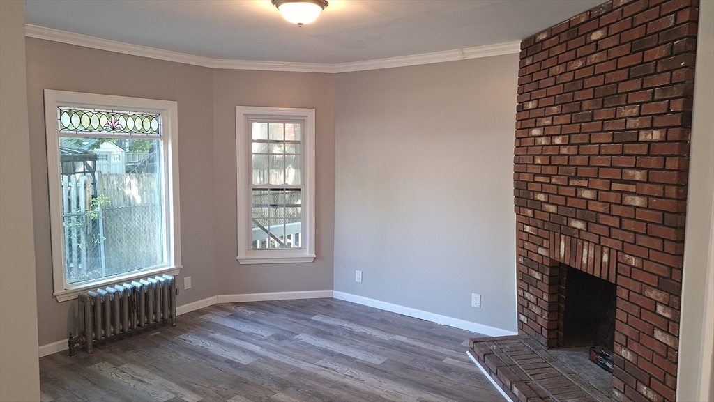 51 View Street Holyoke, MA 01040 - Photo 10 of 16 a view of an empty room with glass door and wooden floor
