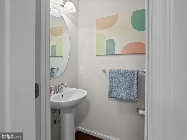 a bathroom with a sink and mirror