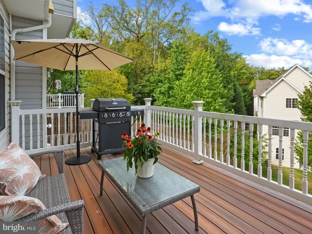 a view of a balcony with furniture