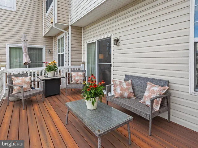 a view of a deck with furniture