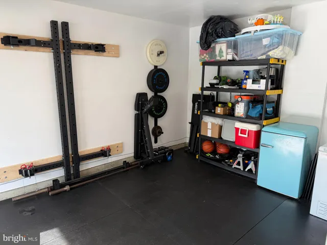 a room with gym equipment and a window