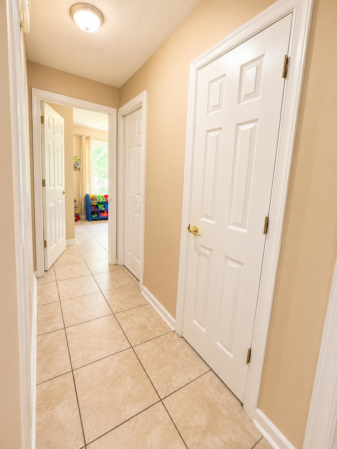 326 South Sanga Road Cordova, TN 38018 - Photo 21 of 32 Hallway featuring light-toned tile flooring and neutral wall paint