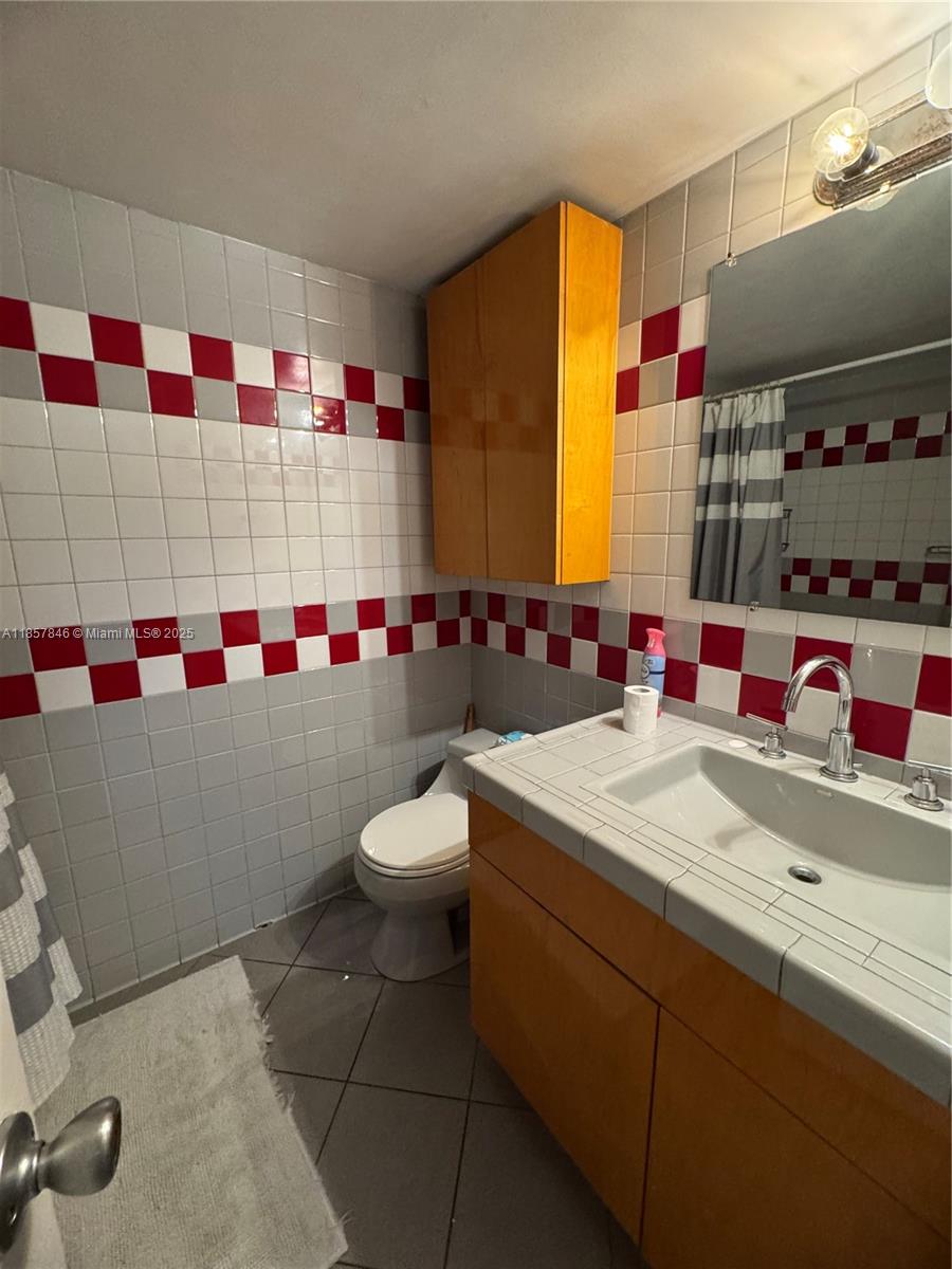 6445 Southwest 116th Place, Unit A Miami, FL 33173 - Photo 11 of 25 a bathroom with a sink toilet and shower