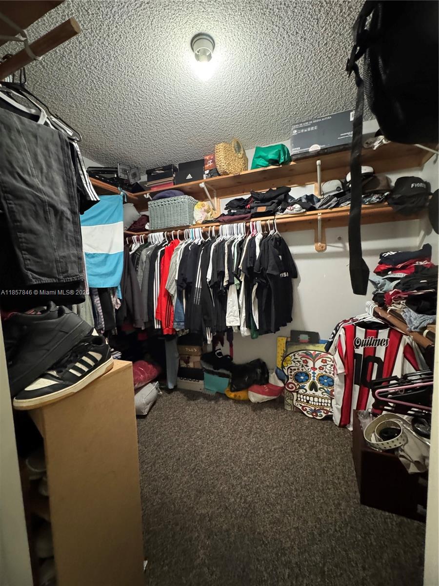 6445 Southwest 116th Place, Unit A Miami, FL 33173 - Photo 16 of 25 a view of a room with gym equipment