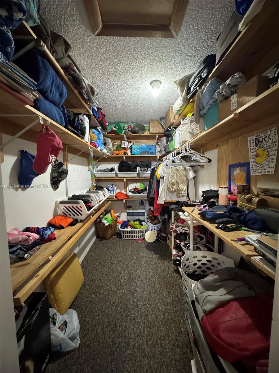 6445 Southwest 116th Place, Unit A Miami, FL 33173 - Photo 20 of 25 a view of a room with gym equipment