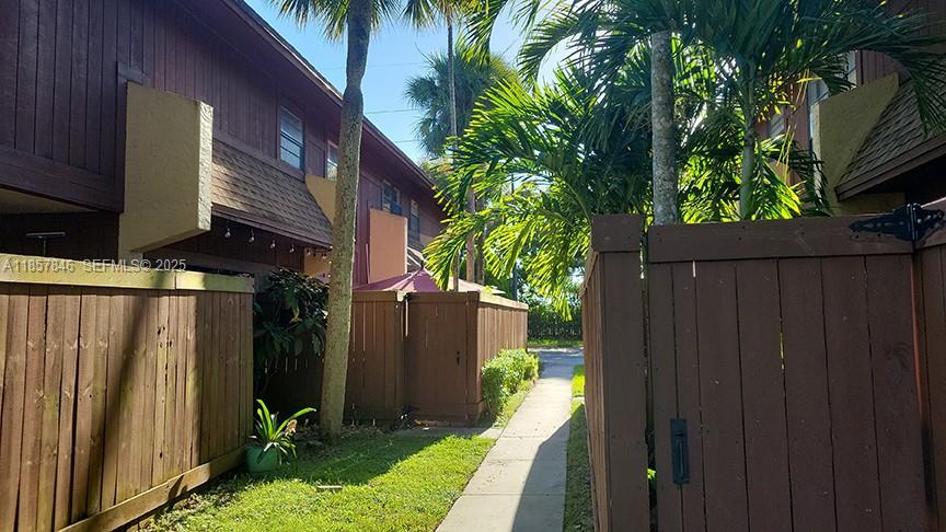 6445 Southwest 116th Place, Unit A Miami, FL 33173 - Photo 2 of 25 a view of a house with a backyard