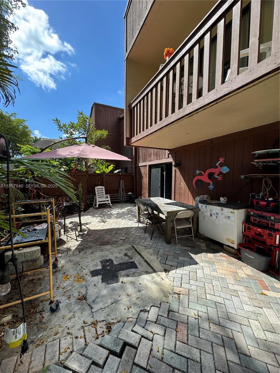 6445 Southwest 116th Place, Unit A Miami, FL 33173 - Photo 24 of 25 a view of a house with backyard and sitting area