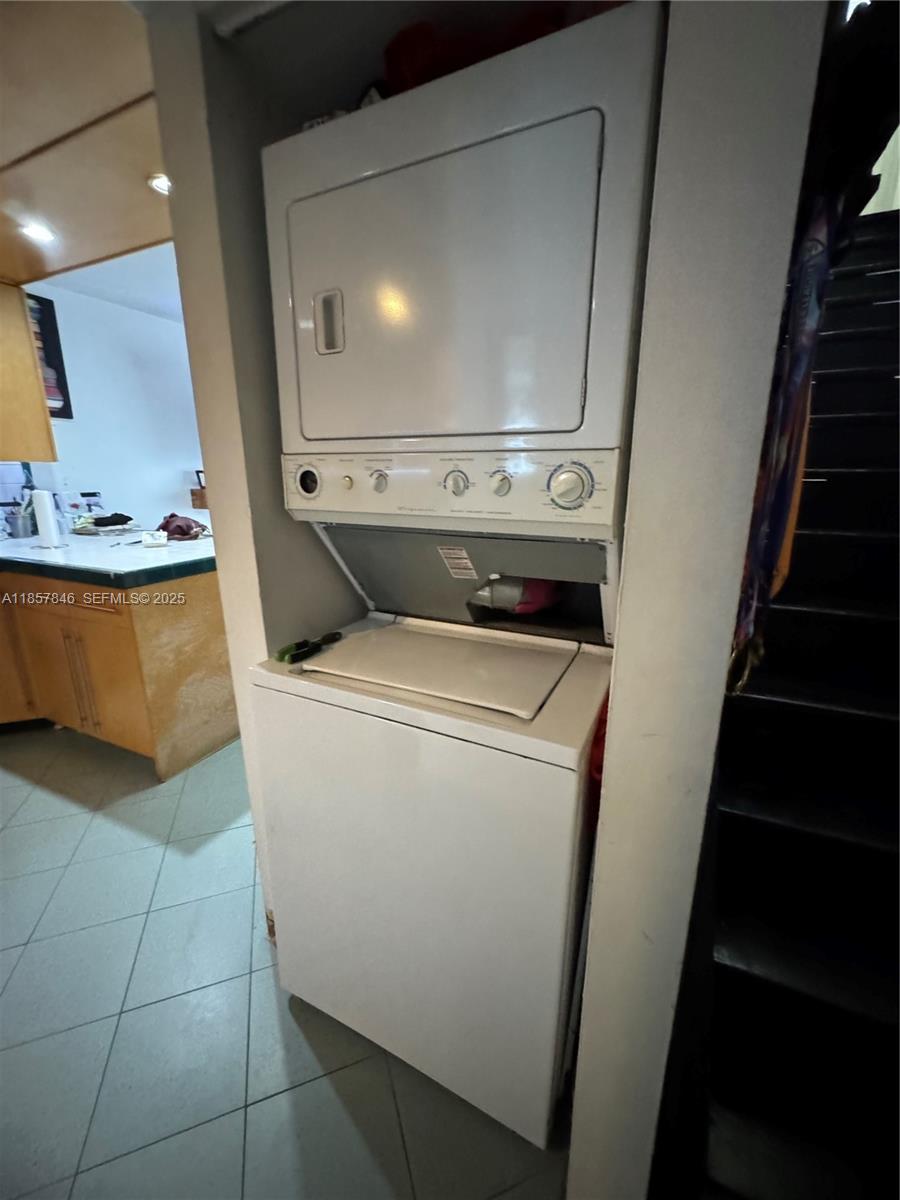 6445 Southwest 116th Place, Unit A Miami, FL 33173 - Photo 8 of 25 a utility room with dryer and washer