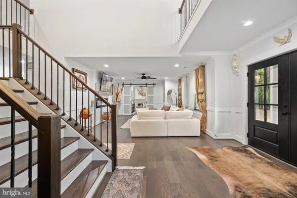 a kitchen with kitchen island a refrigerator stove and a sink