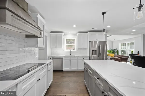 a bedroom with furniture and a large window