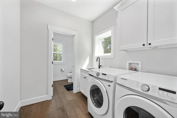 a view of a lake with a bench and trees