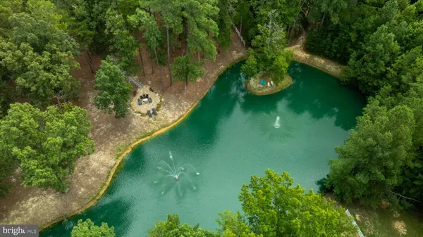 an aerial view of a house with yard