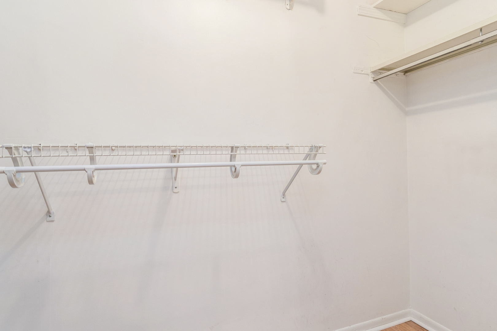 709 79th Street, Unit 401 Darien, IL 60561 - Photo 13 of 20 a view of a room with racks on the wall