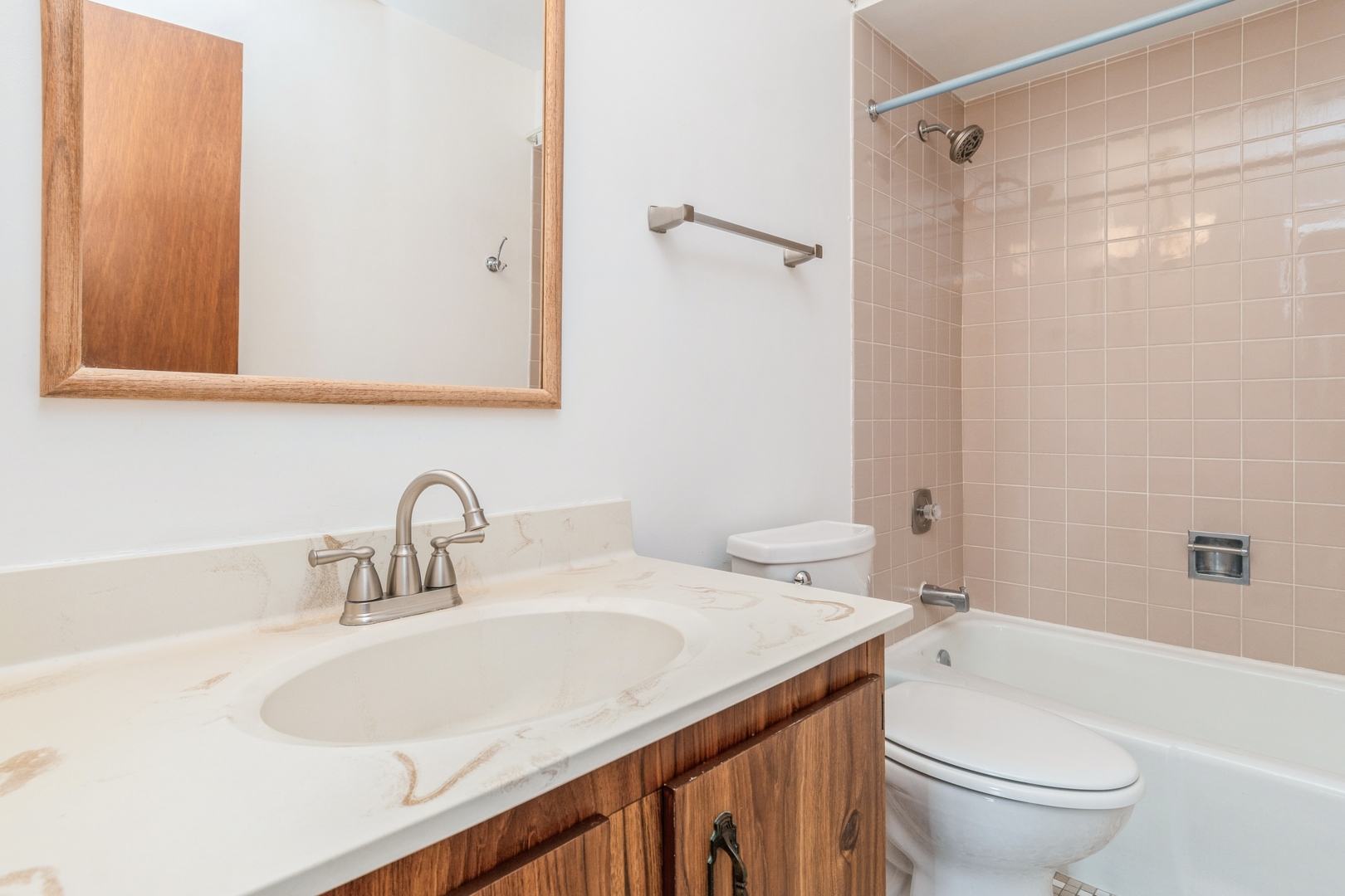 709 79th Street, Unit 401 Darien, IL 60561 - Photo 14 of 20 a bathroom with a sink toilet vanity and shower