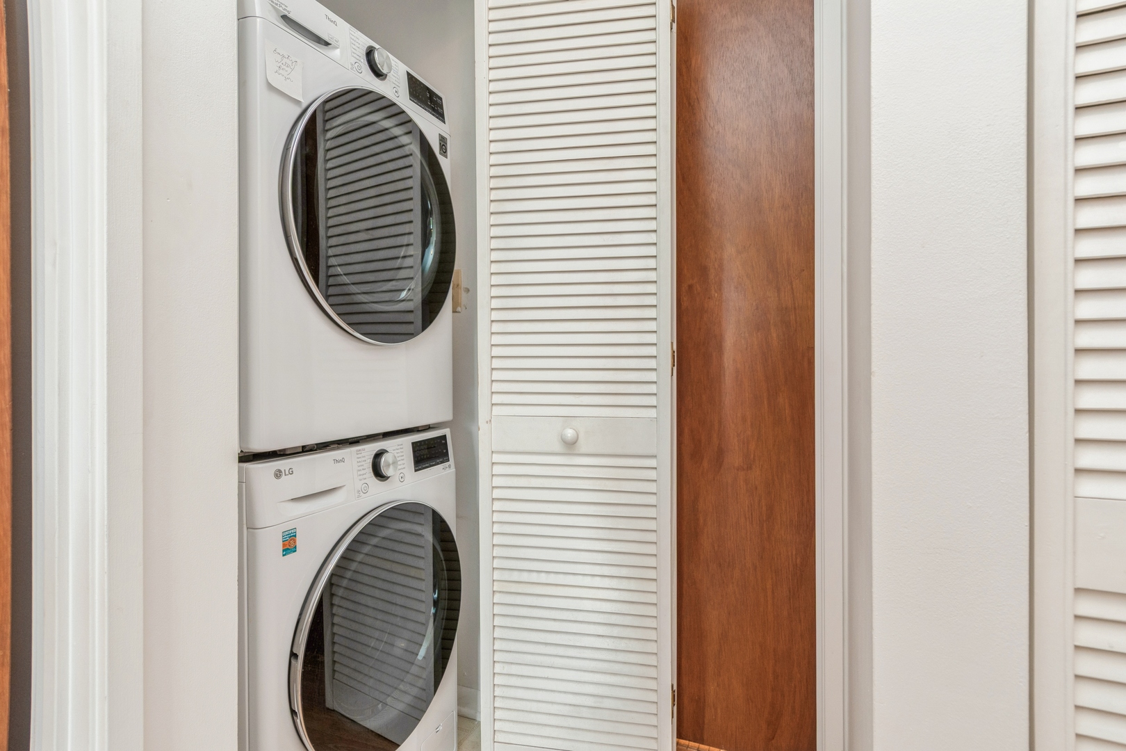 709 79th Street, Unit 401 Darien, IL 60561 - Photo 15 of 20 a view of a hallway with washer and dryer