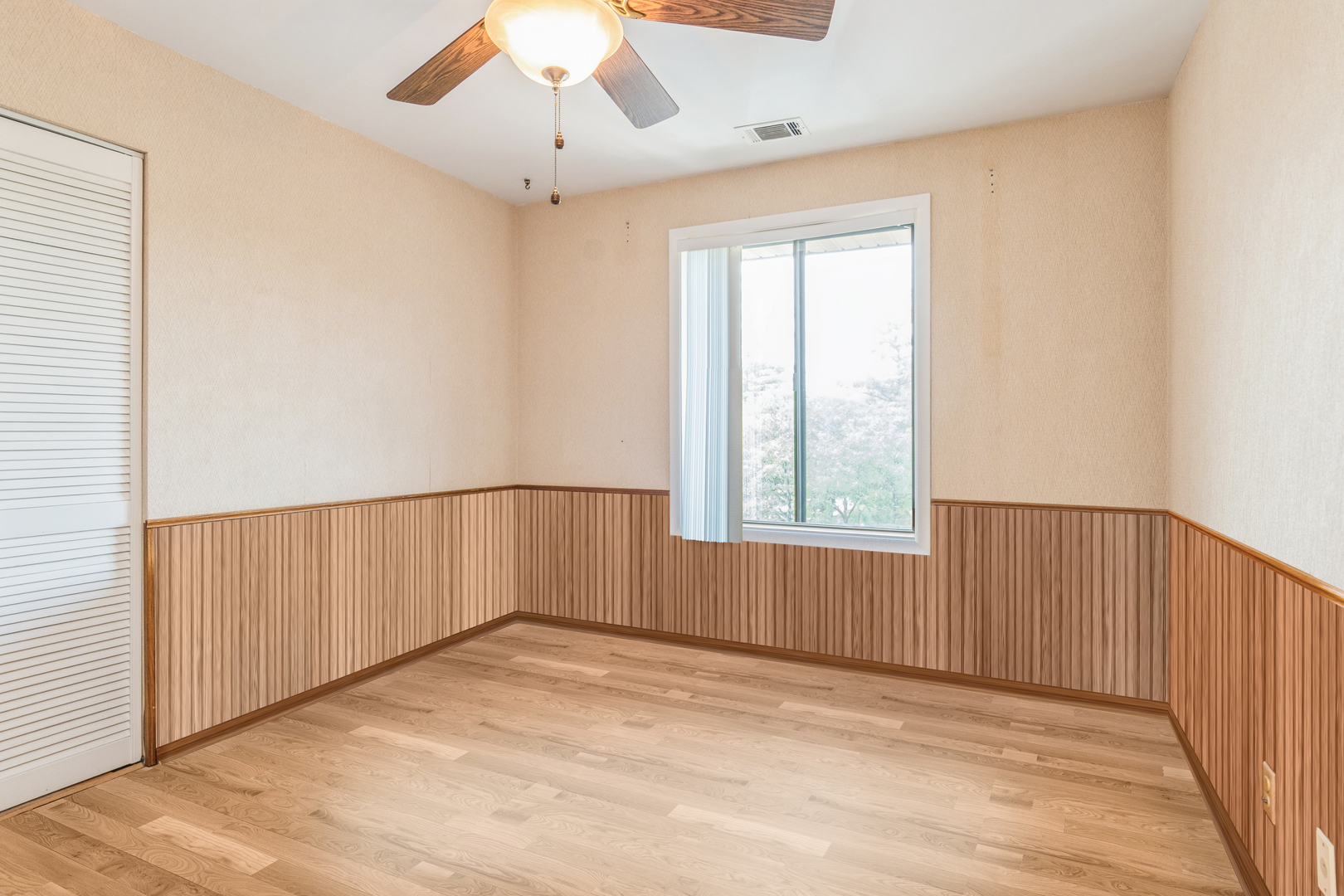 709 79th Street, Unit 401 Darien, IL 60561 - Photo 19 of 20 a view of an empty room with a window