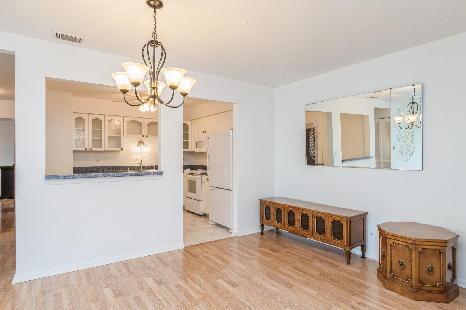 709 79th Street, Unit 401 Darien, IL 60561 - Photo 9 of 20 a view of livingroom with chandelier