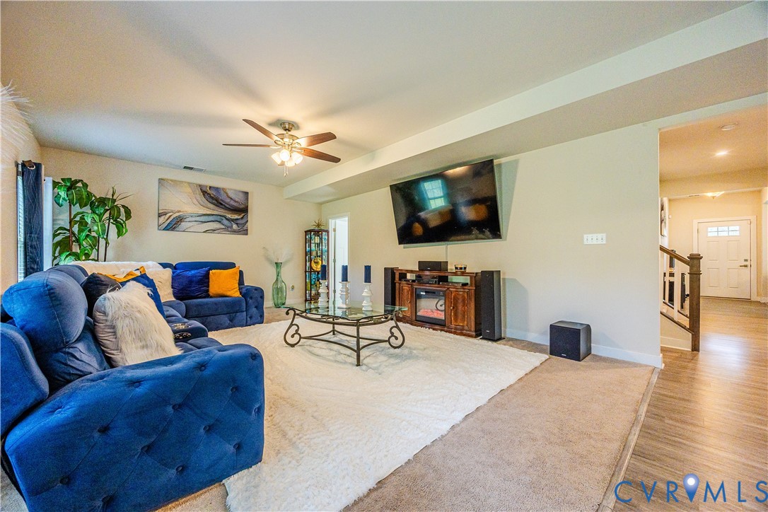 4331 Ganymede Drive Chester, VA 23831 - Photo 11 of 40 a living room with furniture and a flat screen tv