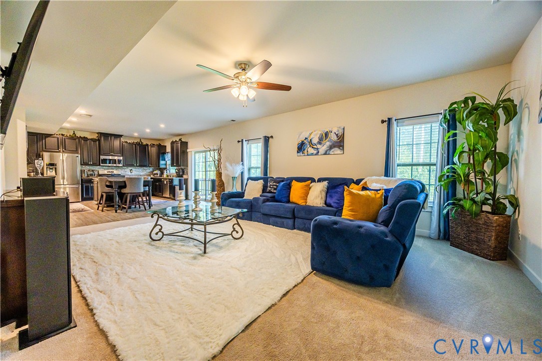 4331 Ganymede Drive Chester, VA 23831 - Photo 12 of 40 a living room with furniture kitchen view and a potted plant