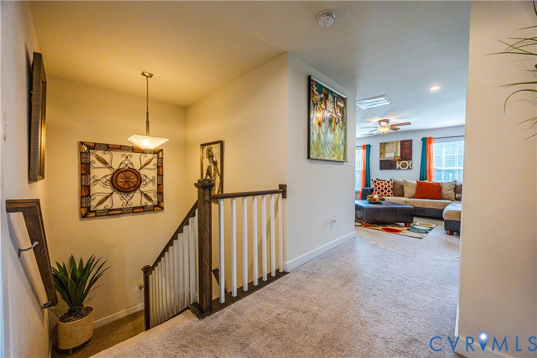 4331 Ganymede Drive Chester, VA 23831 - Photo 16 of 40 a living room with furniture and a chandelier