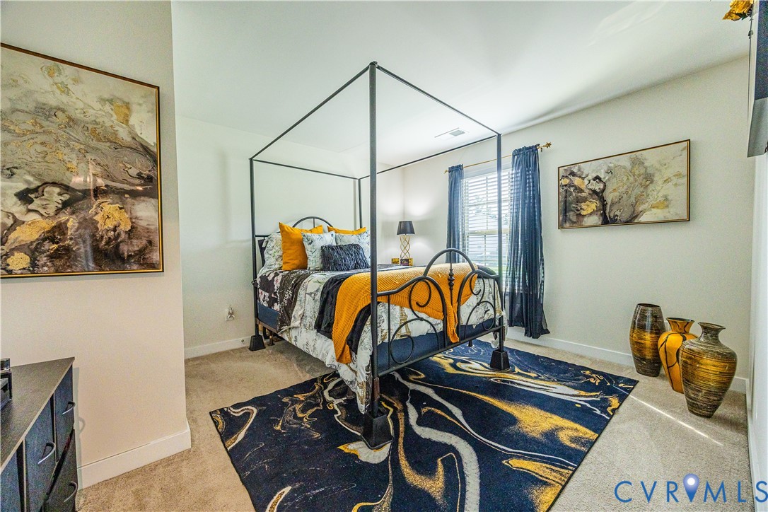 4331 Ganymede Drive Chester, VA 23831 - Photo 20 of 40 a bedroom with furniture and wooden floor