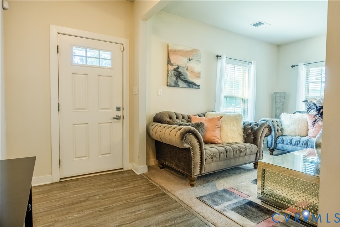 4331 Ganymede Drive Chester, VA 23831 - Photo 2 of 40 a bedroom with a bed and a couch