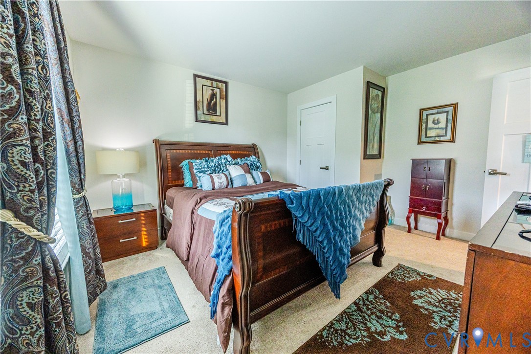 4331 Ganymede Drive Chester, VA 23831 - Photo 23 of 40 a bed room with a bed and a couch
