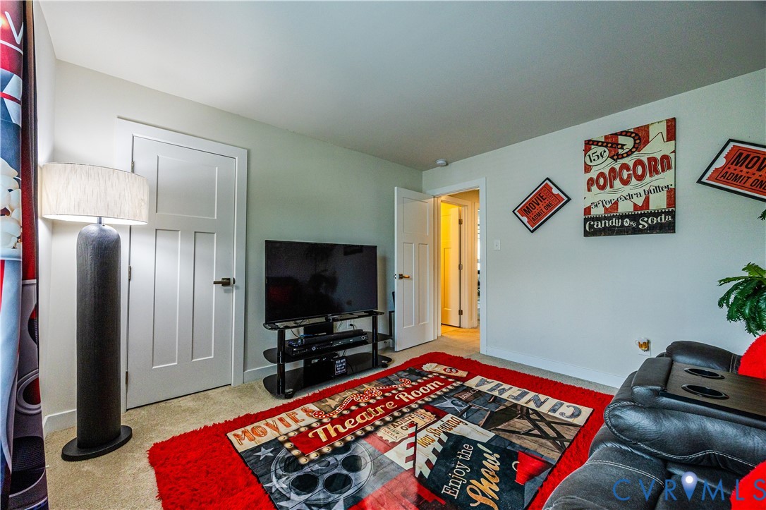 4331 Ganymede Drive Chester, VA 23831 - Photo 25 of 40 a bedroom with a bed and a flat screen tv