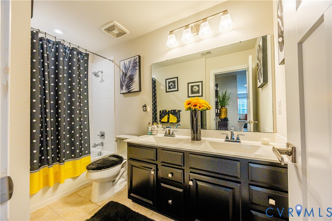 4331 Ganymede Drive Chester, VA 23831 - Photo 26 of 40 a bathroom with a sink mirror vanity and toilet