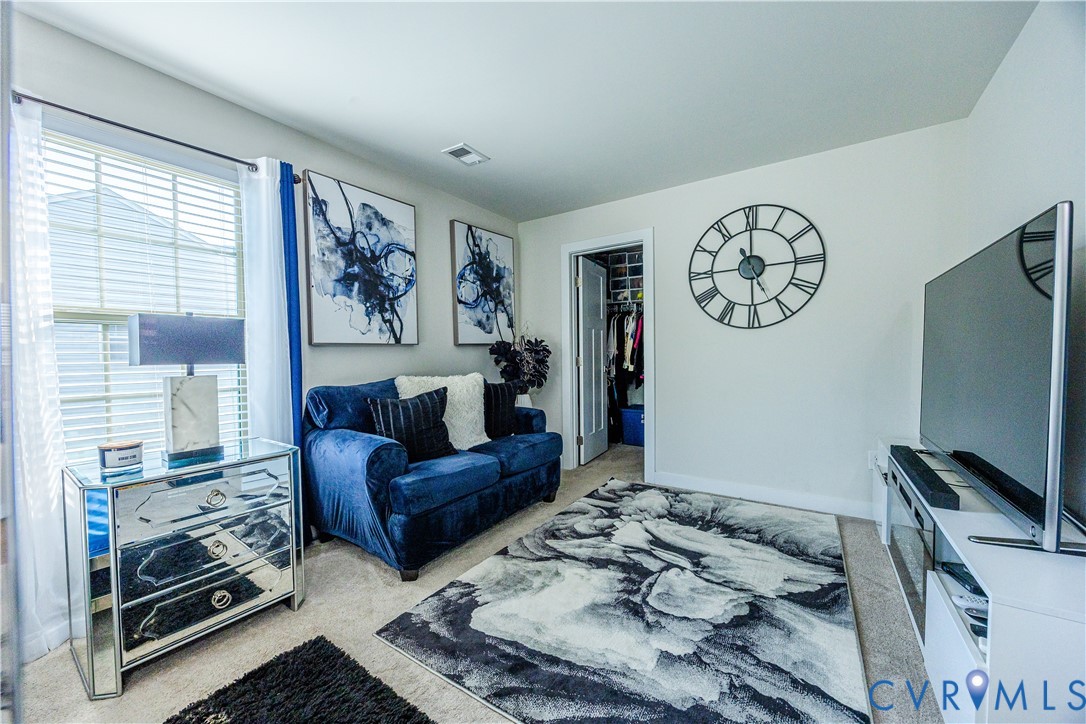 4331 Ganymede Drive Chester, VA 23831 - Photo 30 of 40 a living room with furniture and a flat screen tv