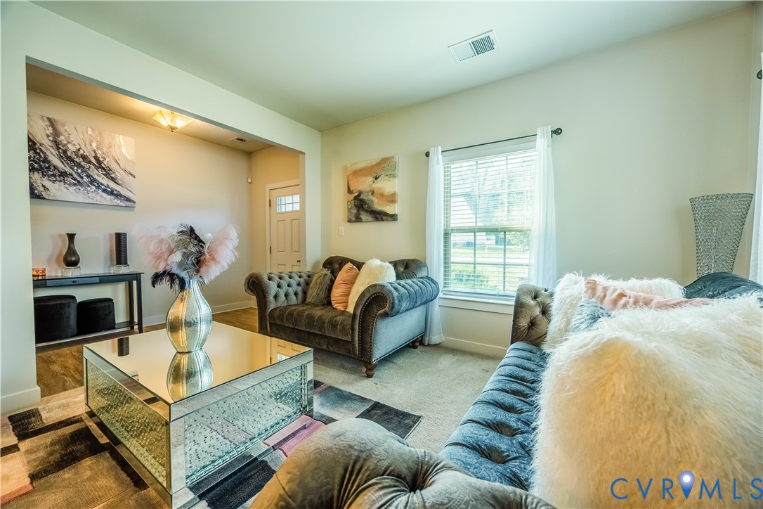 4331 Ganymede Drive Chester, VA 23831 - Photo 3 of 40 a living room with furniture and a table
