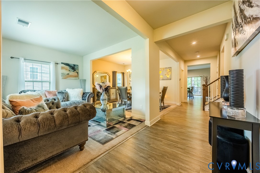 4331 Ganymede Drive Chester, VA 23831 - Photo 4 of 40 a living room with furniture and a flat screen tv