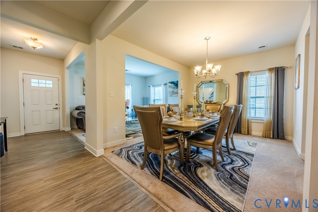 4331 Ganymede Drive Chester, VA 23831 - Photo 5 of 40 a view of a dining room with furniture and wooden floor