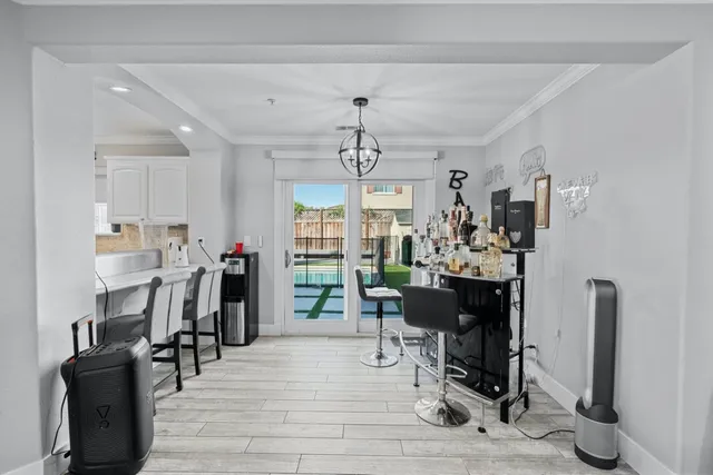 a view of a dining room with furniture and window