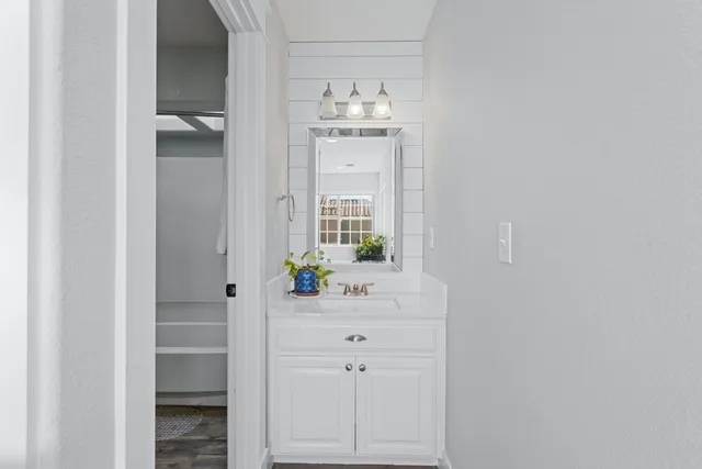 a bathroom with a sink and a mirror