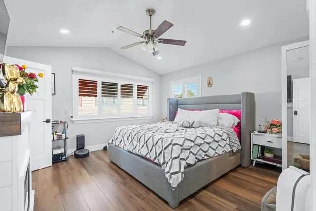 a bedroom with a bed and a table